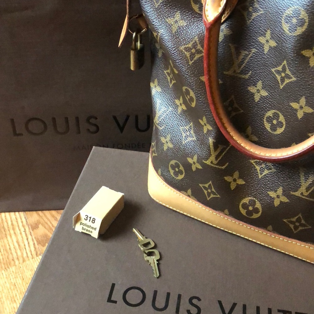 Louis Vuitton LockIt PM Bag